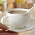 white ceramic cup and saucer